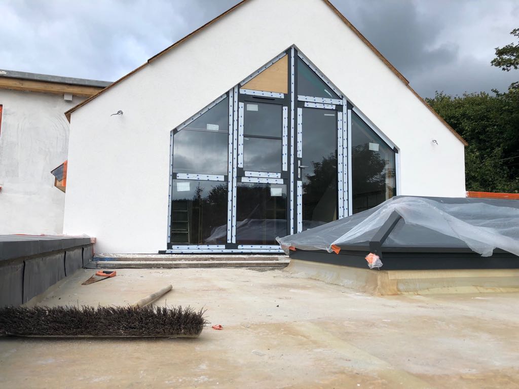 Two-storey glazed gable extension