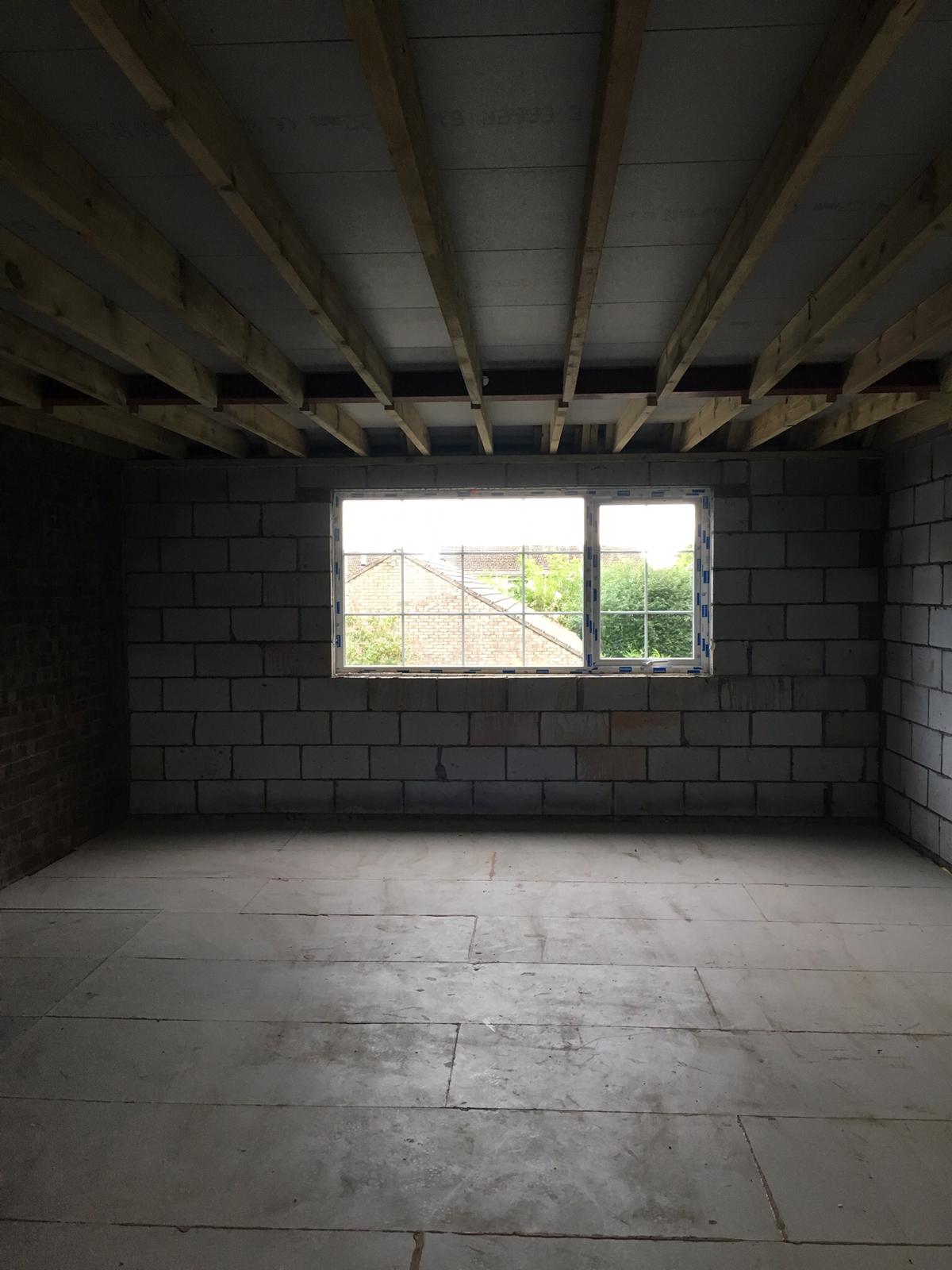 Blockwork extension shell with exposed ceiling joists