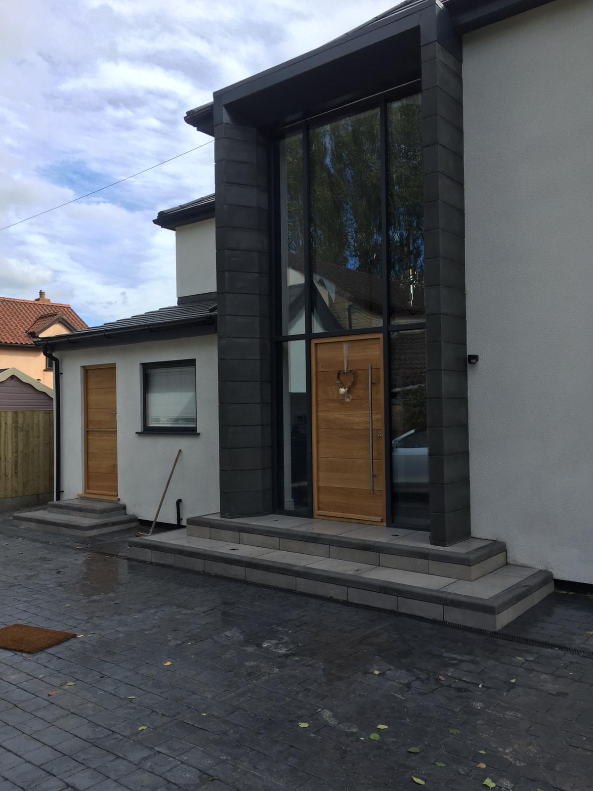 Modern grey rear extension with sliding doors