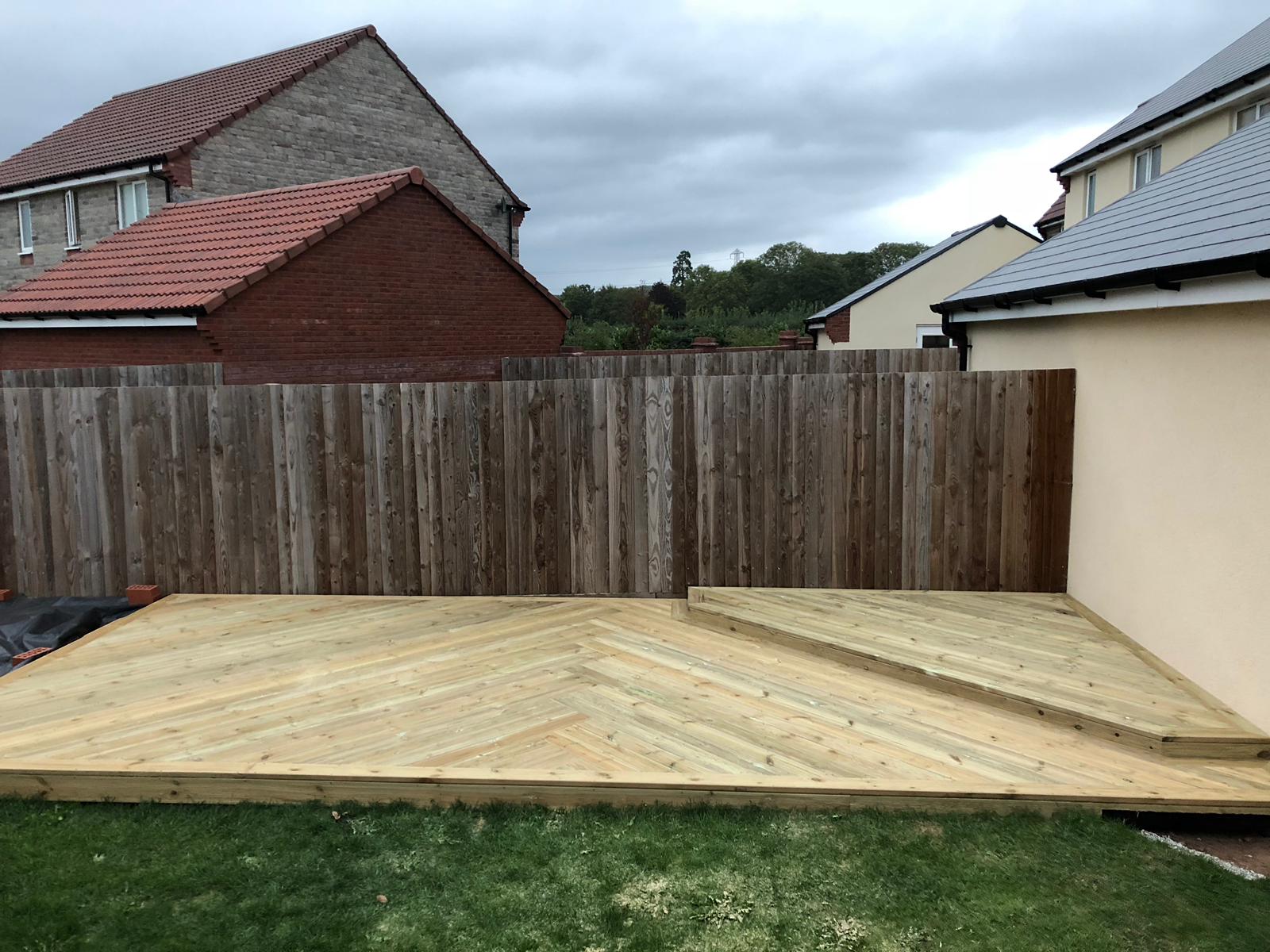 Large timber deck wrapping a garden boundary