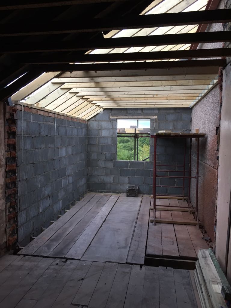 Rear extension structure with rooflight opening and blockwork walls