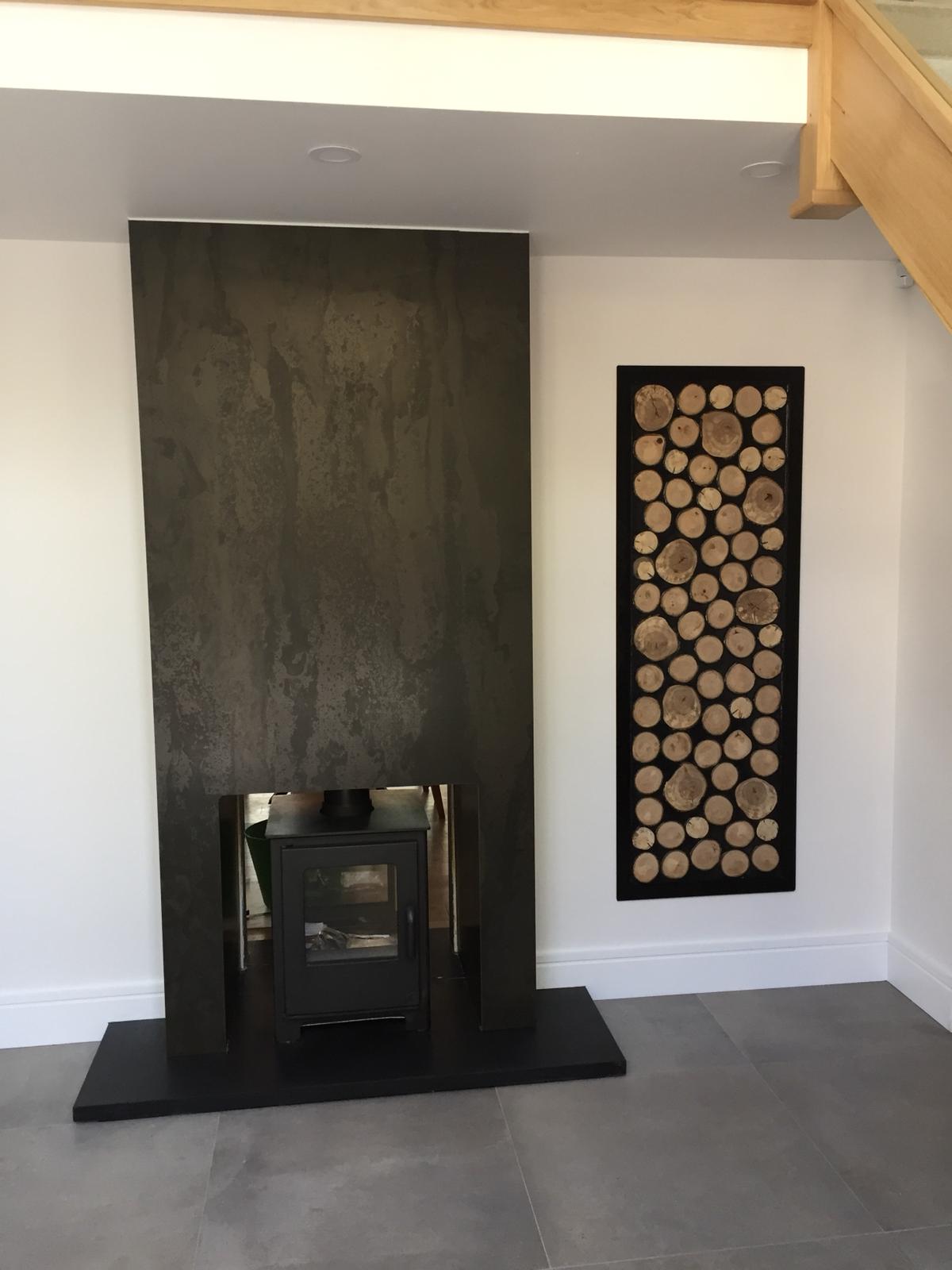Wood burner installation with log storage detail