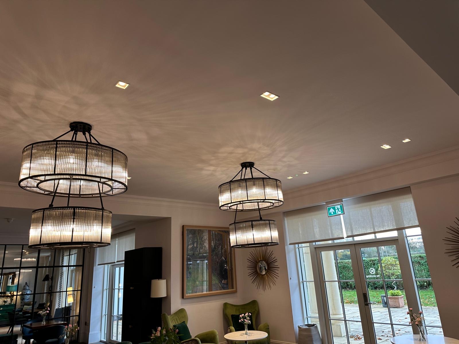 Period townhouse lounge with chandeliers and velvet seating