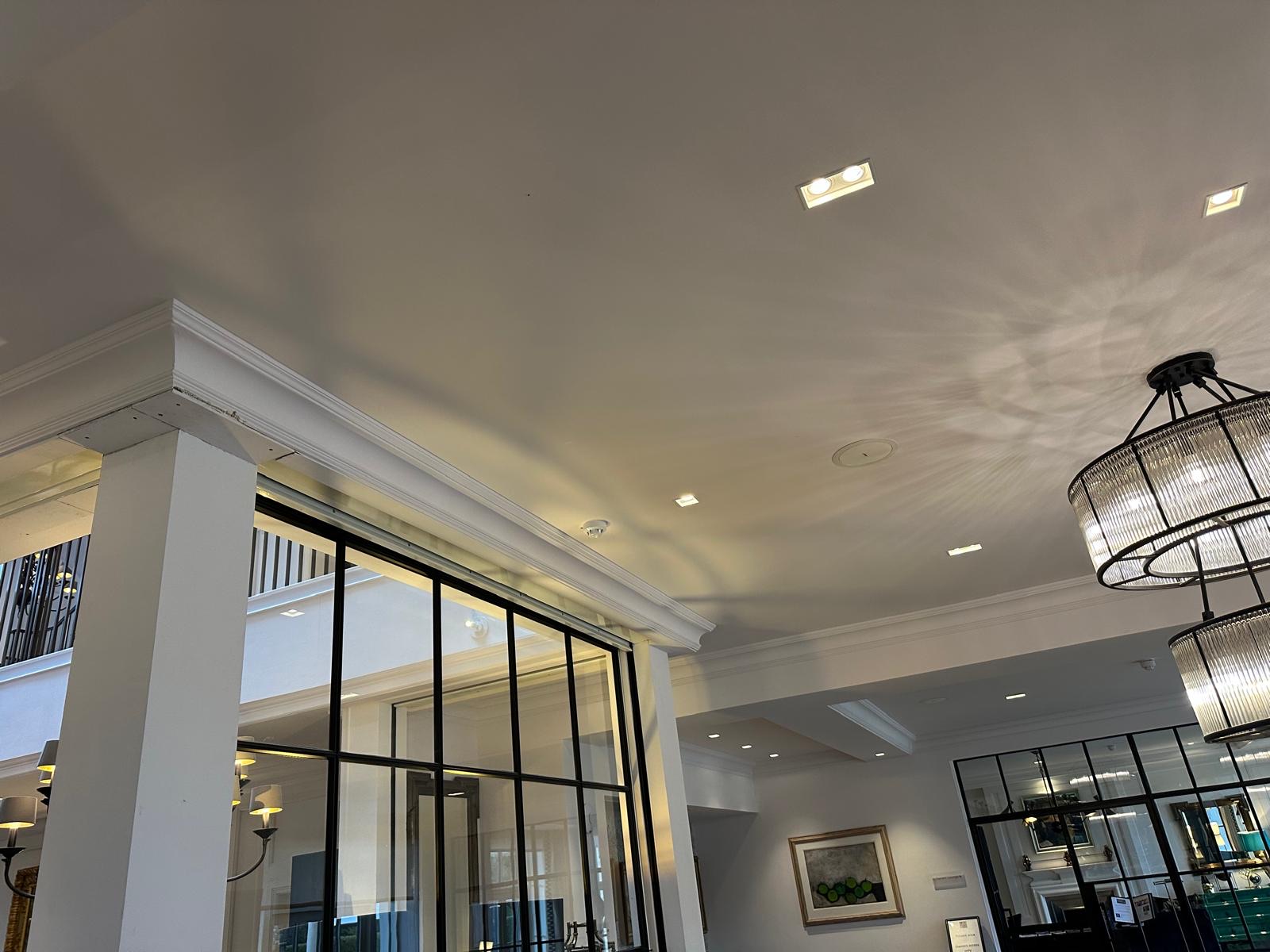 Period property lounge with chandeliers and Crittall doors