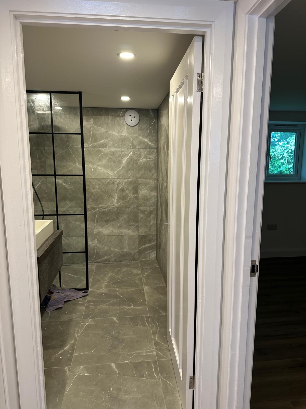 Marble bathroom with Crittall shower screen