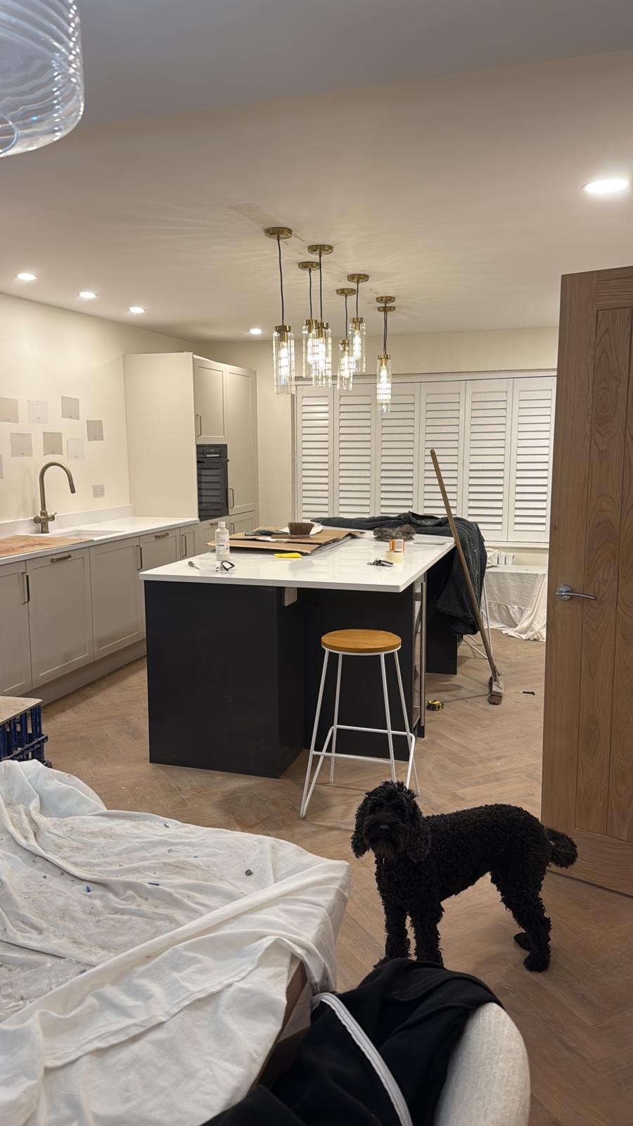 Modern kitchen with marble island and pendant lighting