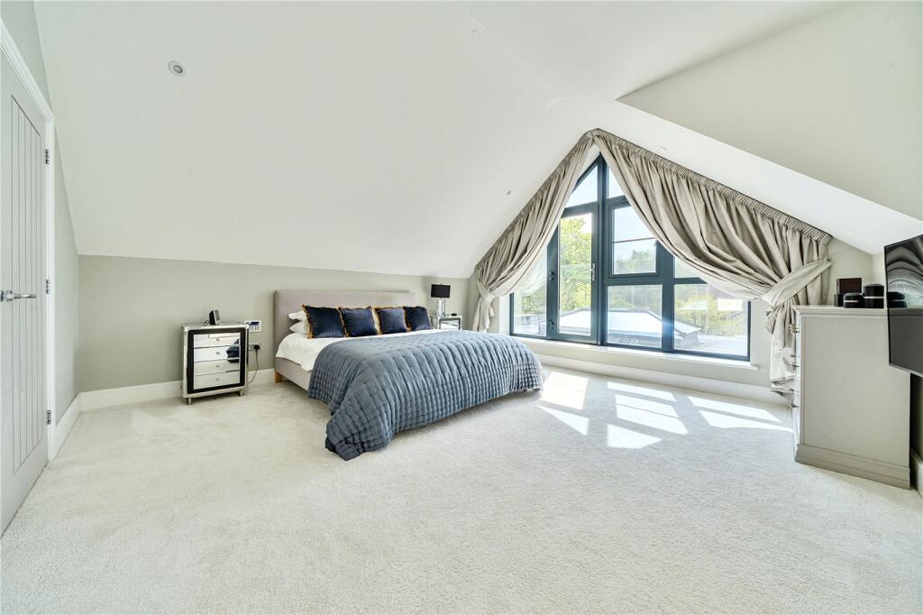 Dormer loft bedroom with sloped ceiling