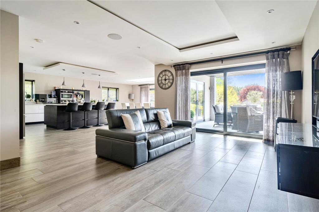 Open-plan kitchen, living and dining with sliders