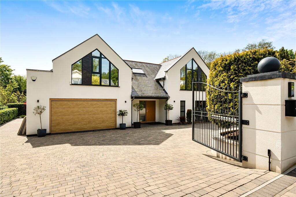 Modern residential new build with double oak electric gates
