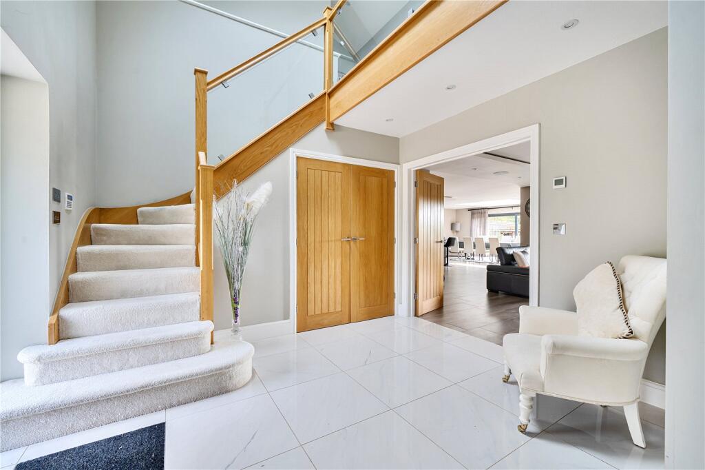 Oak gallery hallway with stair detail and white walls