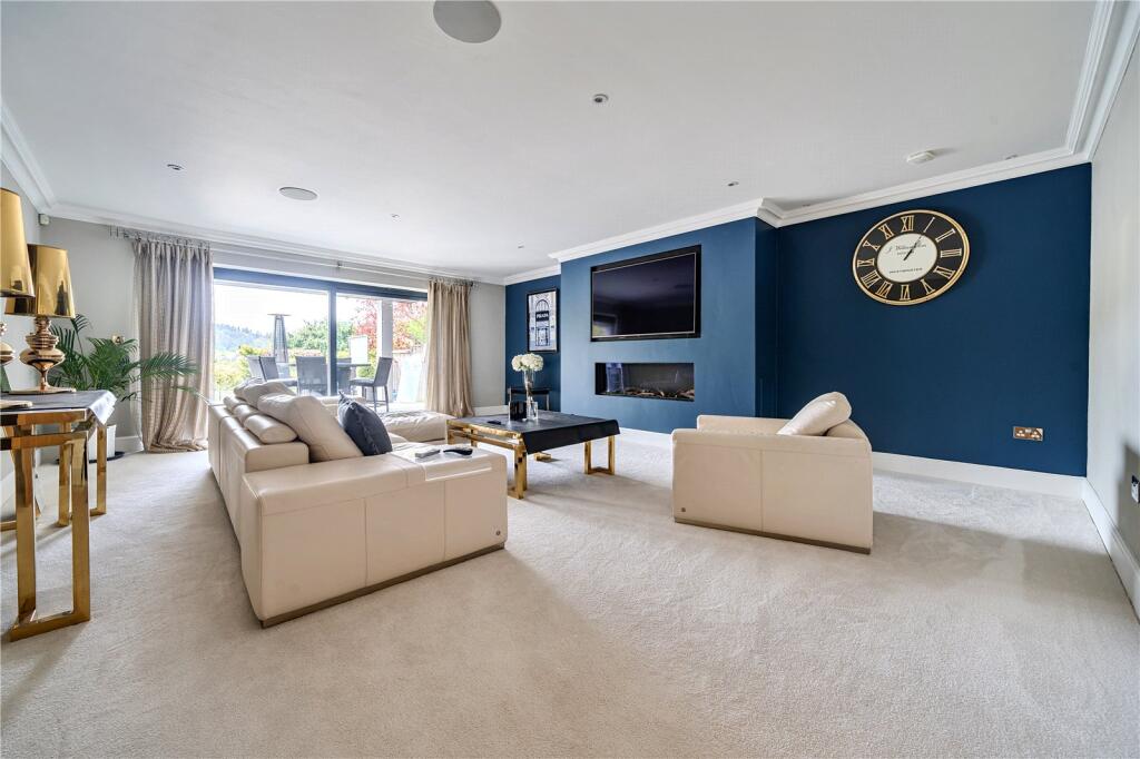 Period property living room with deep-blue feature wall